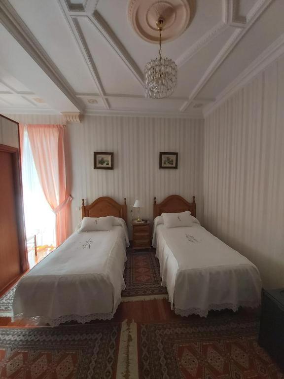 Posteľ alebo postele v izbe v ubytovaní Pension Lorea