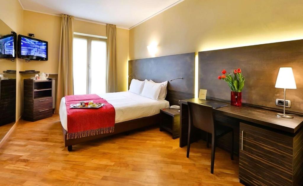 Postel nebo postele na pokoji v ubytování Best Western Hotel Metropoli