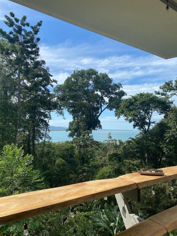 a view of the forest from the balcony of a house at Tropical Sea View Villa in Puerto Viejo