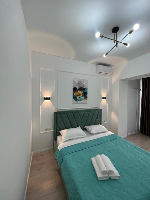 Ένα ή περισσότερα κρεβάτια σε δωμάτιο στο Komfort city apartments