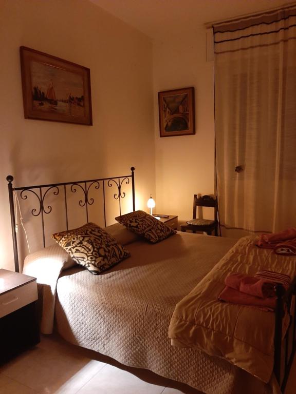 Postel nebo postele na pokoji v ubytování Locazione Turistica Poker d'assi