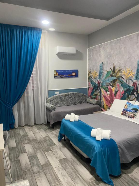 Posteľ alebo postele v izbe v ubytovaní B&B VIVA NAPOLI