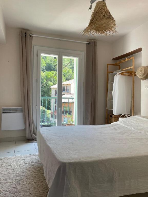 Ένα ή περισσότερα κρεβάτια σε δωμάτιο στο Appartement dans la nature