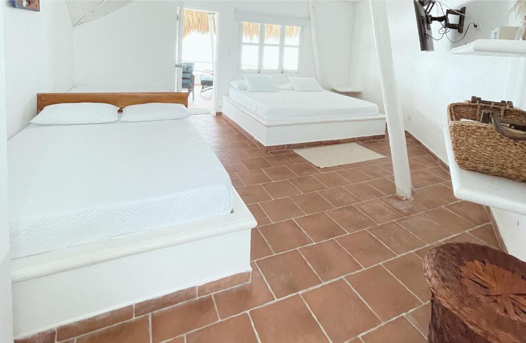 Postel nebo postele na pokoji v ubytování Quinta del Mar Crystal Beach