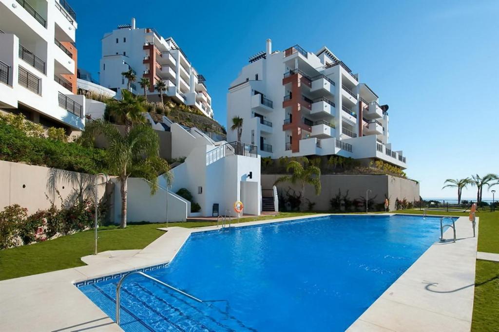 Bazén v ubytování Apartamento con impresionantes vistas al mar nebo v jeho okolí
