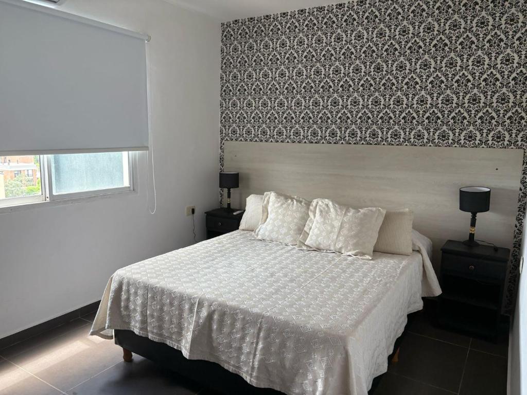 Ένα ή περισσότερα κρεβάτια σε δωμάτιο στο EDIFICIO REY NIÑO