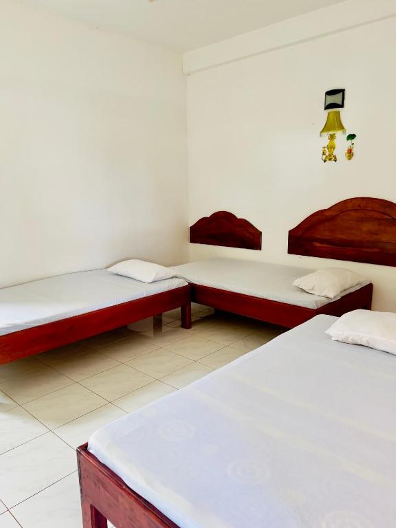 Postel nebo postele na pokoji v ubytování Seafood king hostel