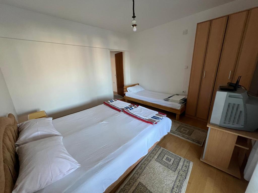 A bed or beds in a room at Guest House Plima 2