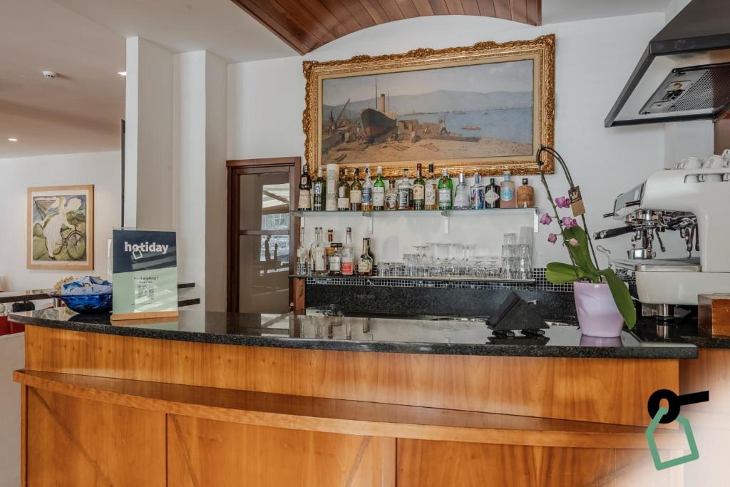 Lounge nebo bar v ubytování HOTIDAY Room Collection - Le Grazie