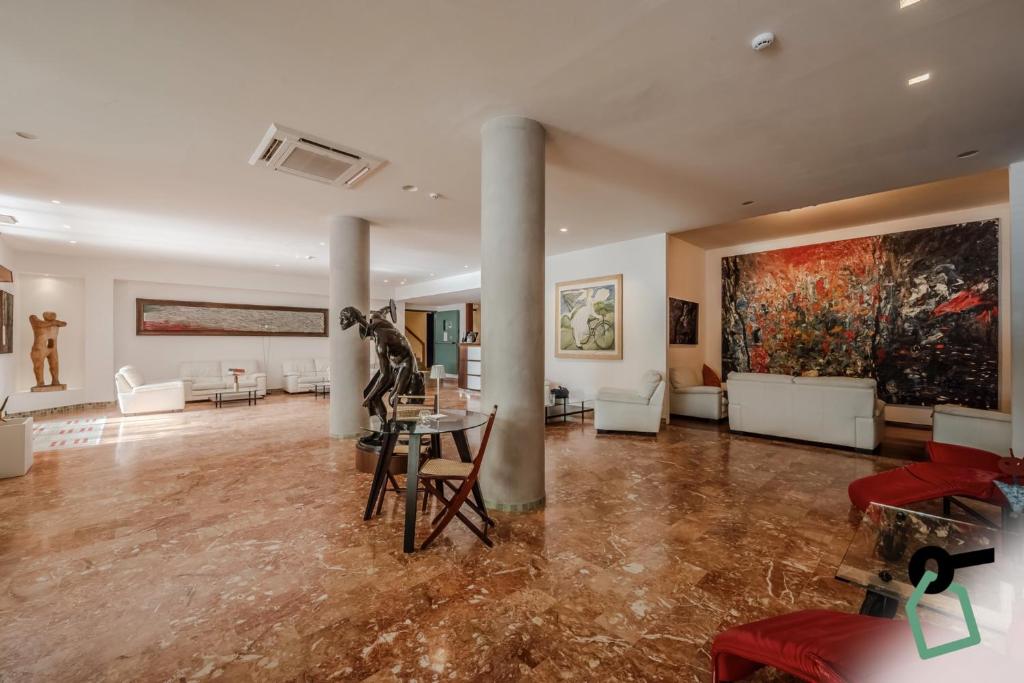 Posezení v ubytování HOTIDAY Room Collection - Le Grazie