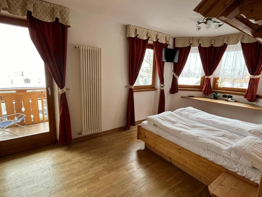Postel nebo postele na pokoji v ubytování Garnì Costa Verde