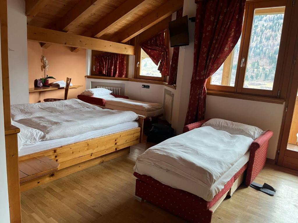Postel nebo postele na pokoji v ubytování Garnì Costa Verde