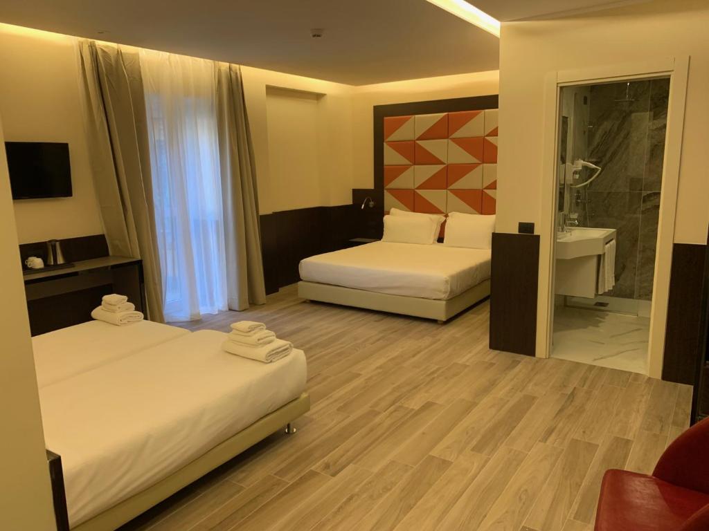 Postel nebo postele na pokoji v ubytování Jr Hotels Bocconi Milano
