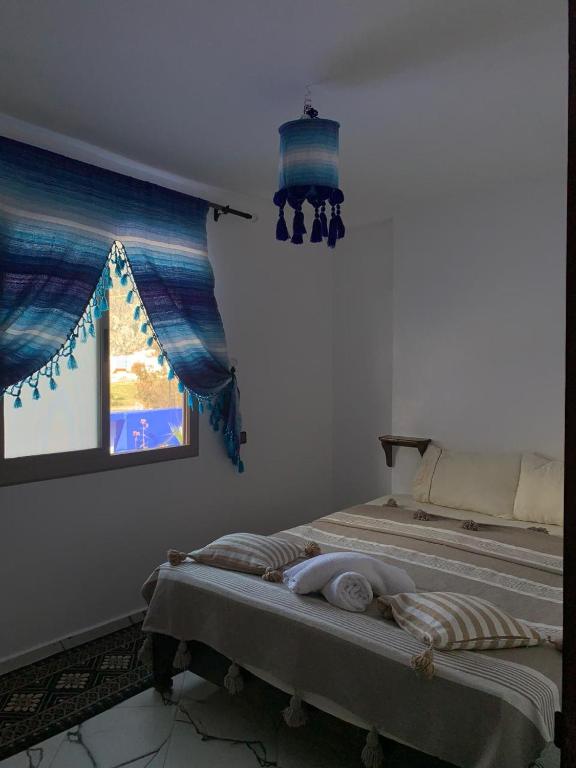 Postel nebo postele na pokoji v ubytování house naim