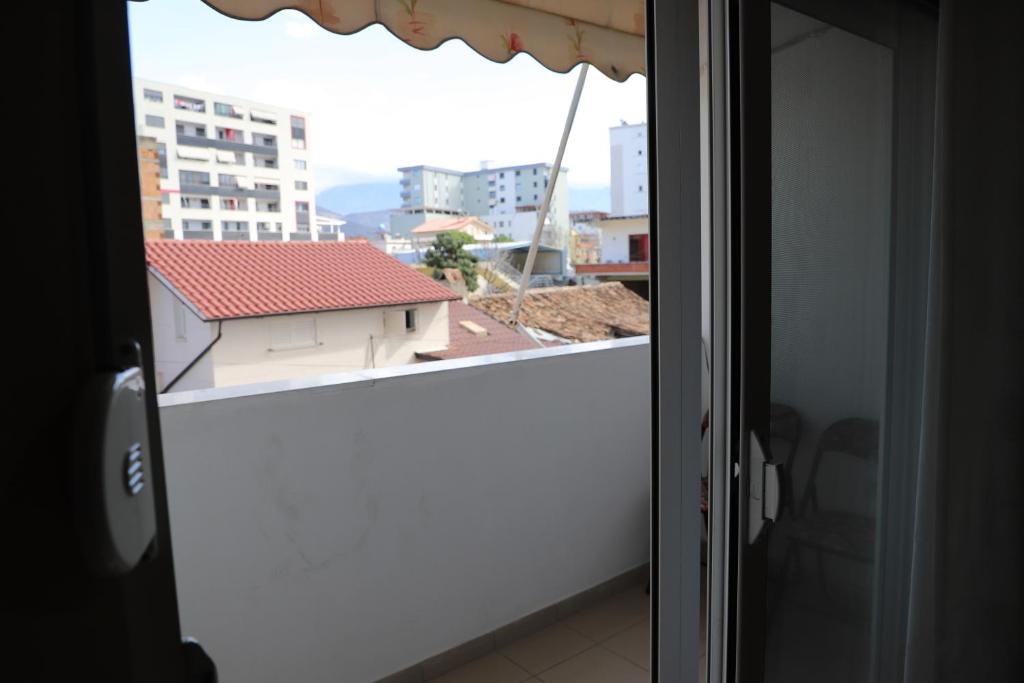 an open window with a view of a building at Apartment Rita Berat in Berat