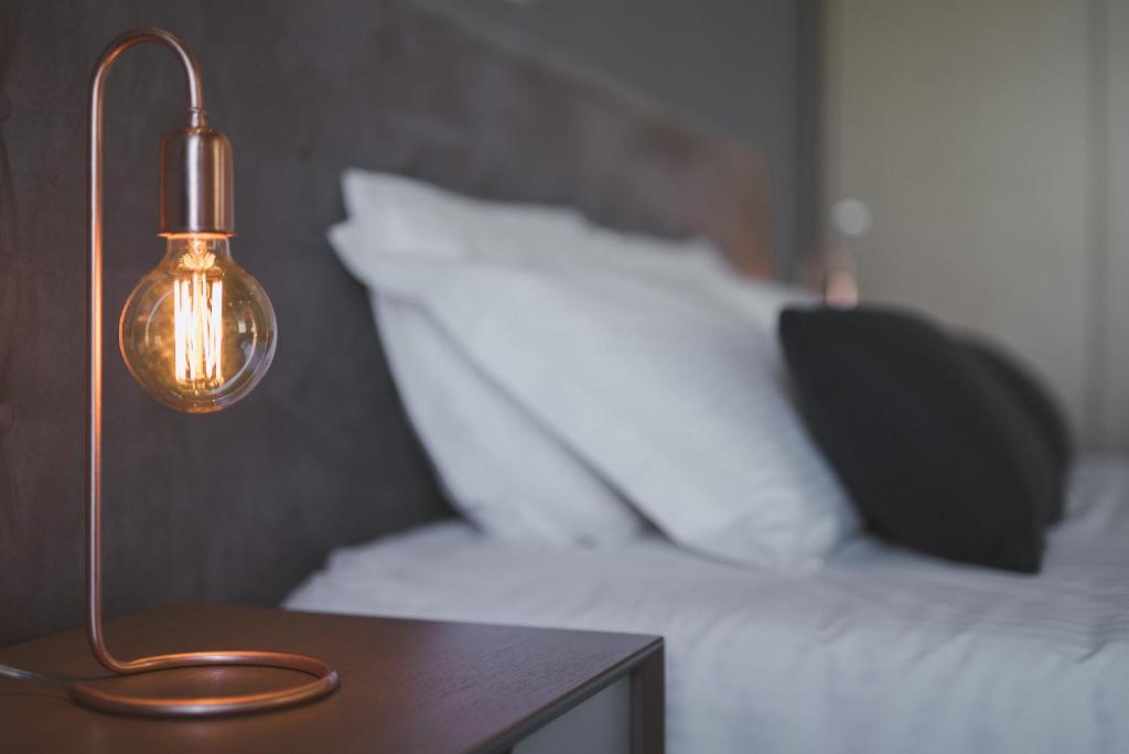 Łóżko lub łóżka w pokoju w obiekcie Bluebell Luxury Suites