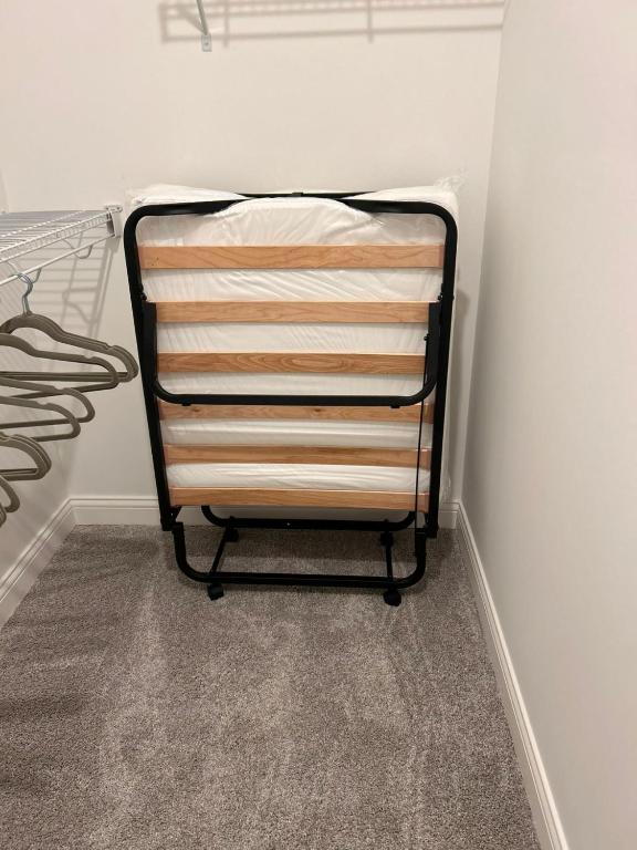 a wooden towel rack in a corner of a closet at Grandeur Unit Royal 103 in Whitestown