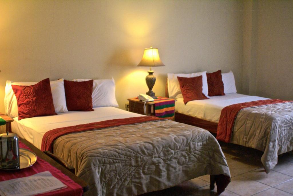 Ένα ή περισσότερα κρεβάτια σε δωμάτιο στο Hotel Ipsan Nah