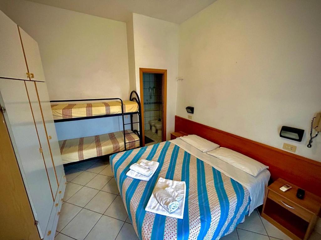 Postel nebo postele na pokoji v ubytování Hotel Sacramora