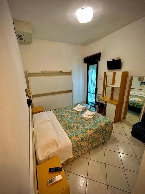 Postel nebo postele na pokoji v ubytování Hotel Sacramora