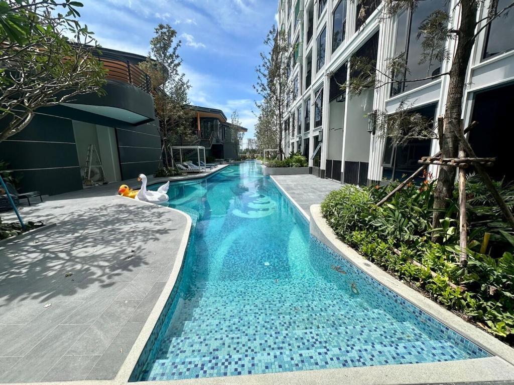 a swimming pool in the middle of a building at Bellevue Lagoon Phuket in Laguna Phuket