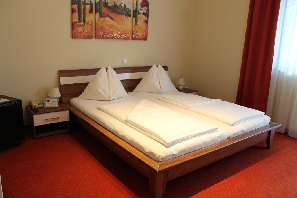 Postel nebo postele na pokoji v ubytování Hotel Restaurant Schwartz