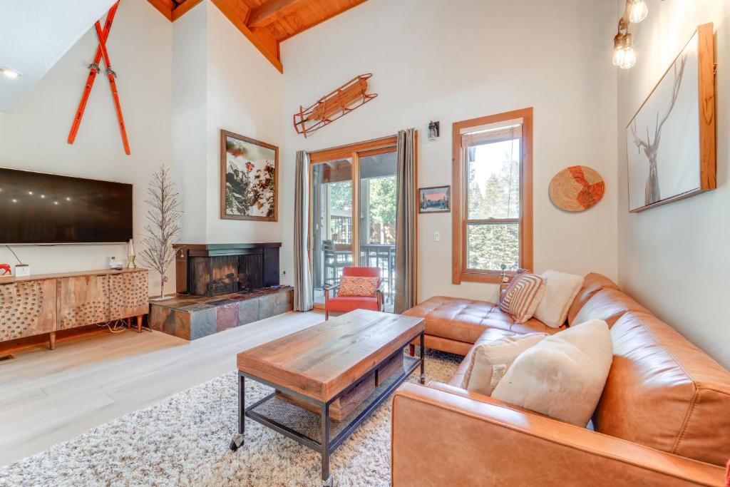 a living room with a couch and a table at 8 Mi to Lake Tahoe Spacious Northstar Condo! in Truckee
