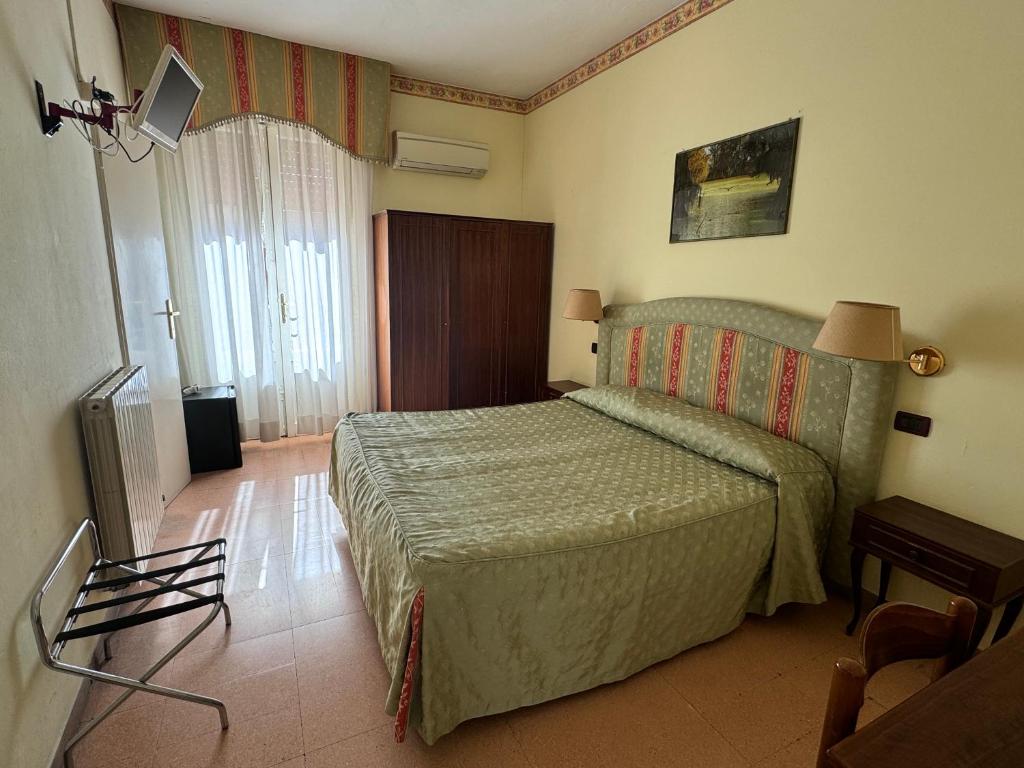 Postel nebo postele na pokoji v ubytování Hotel Ely
