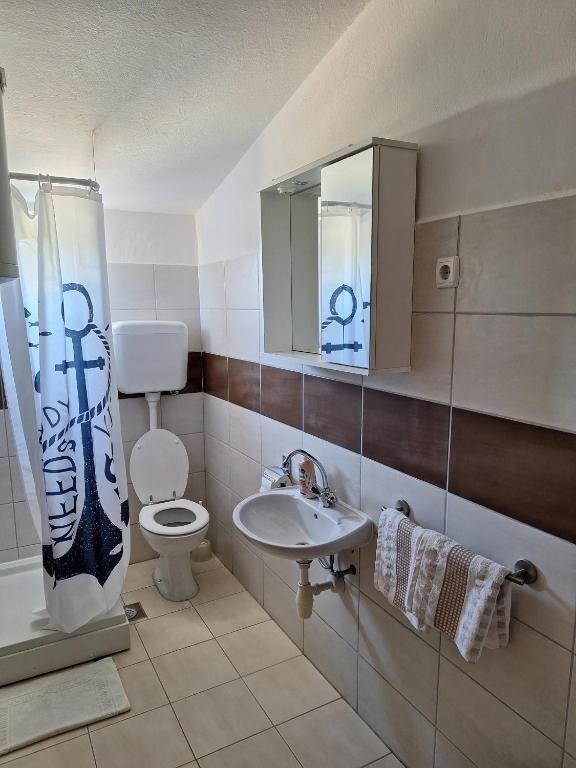 Koupelna v ubytování Apartmani Belobrk Potocnica Pag