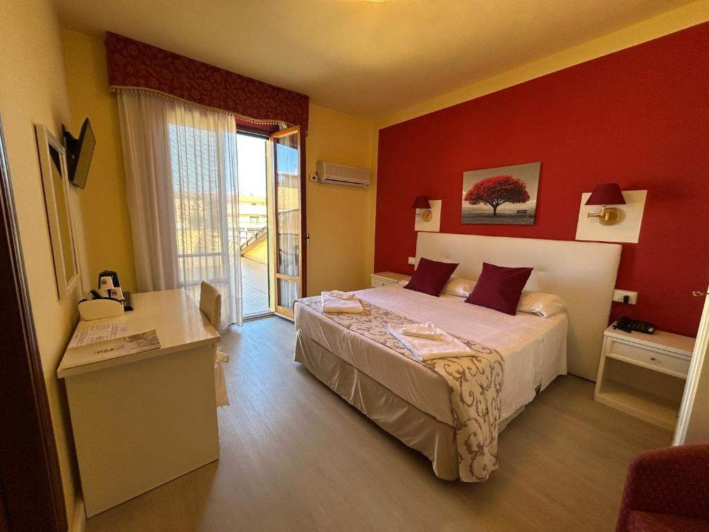 Postel nebo postele na pokoji v ubytování Hotel Duca Della Corgna