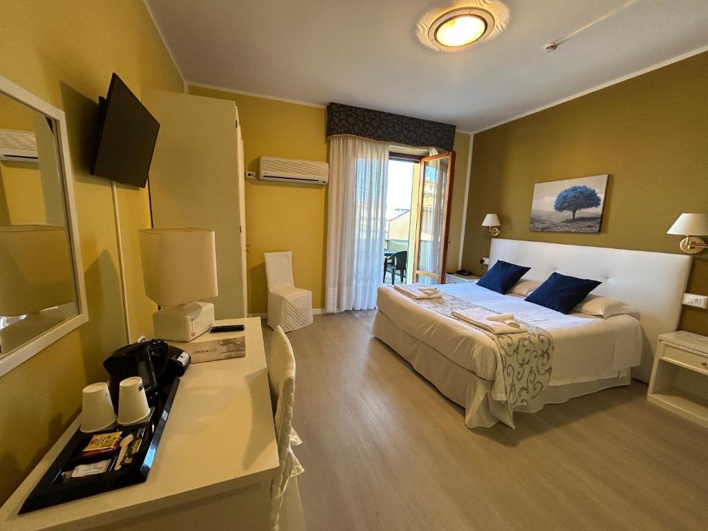 Postel nebo postele na pokoji v ubytování Hotel Duca Della Corgna