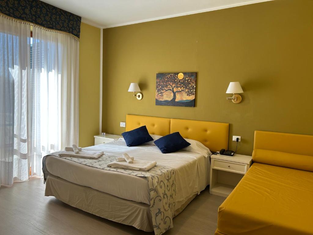 Postel nebo postele na pokoji v ubytování Hotel Duca Della Corgna