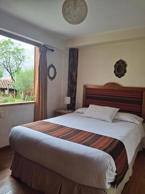 Postel nebo postele na pokoji v ubytování Casona La Recoleta
