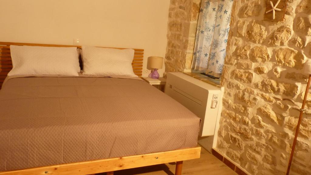 Postel nebo postele na pokoji v ubytování To Portoni Guesthouse