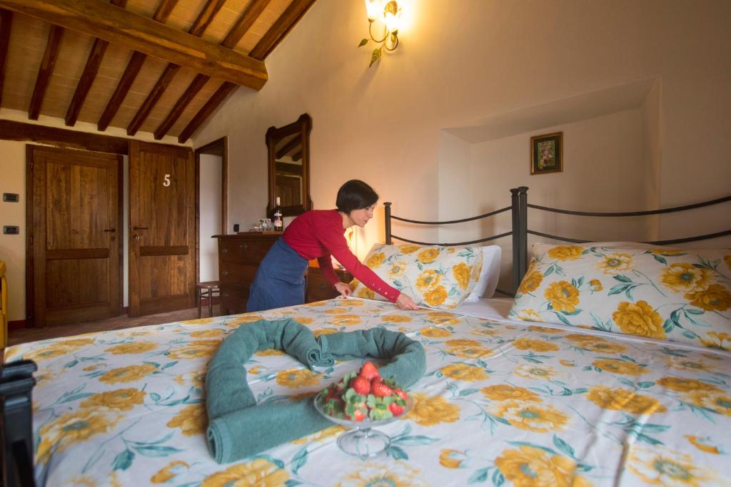 Postel nebo postele na pokoji v ubytování Podere Cerciano