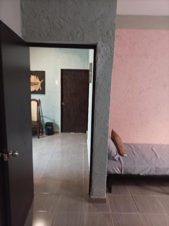 Voodi või voodid majutusasutuse Habitaciones Dos Antonios toas