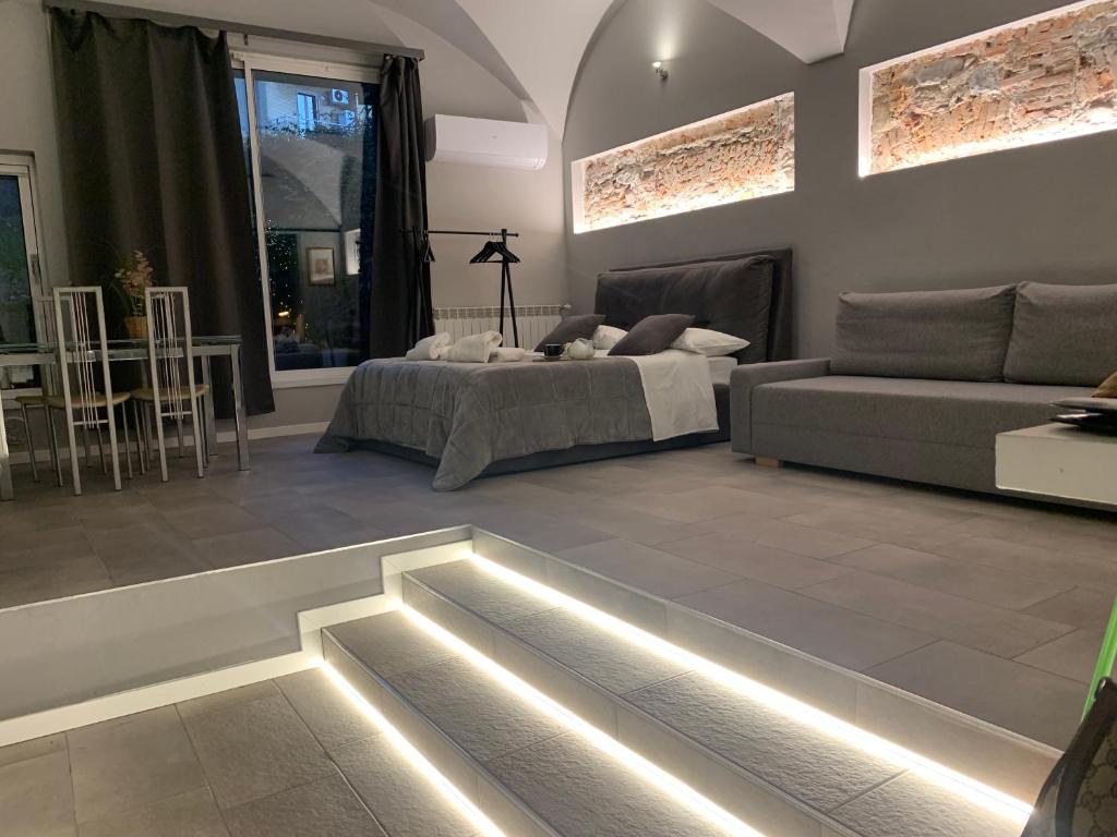 a living room with a bed and a swimming pool at Molino nuovo in Maslianico