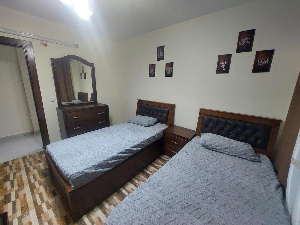 Postel nebo postele na pokoji v ubytování New zarqa