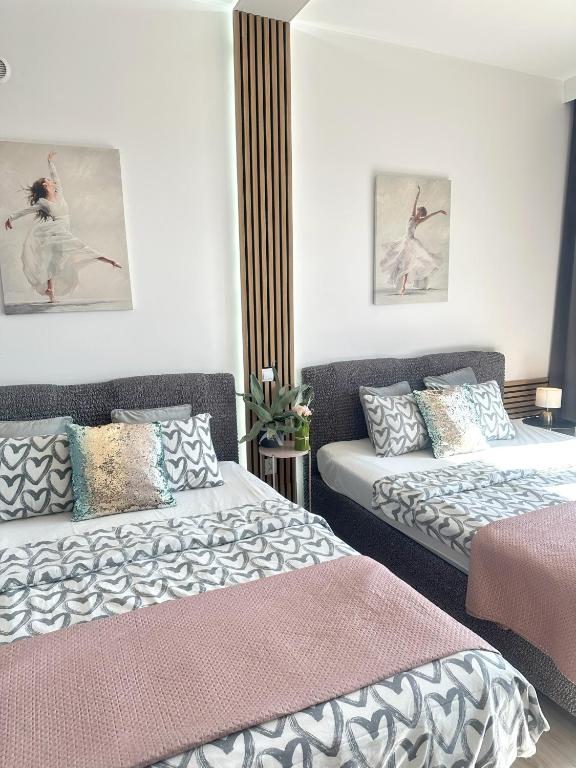 Posteľ alebo postele v izbe v ubytovaní Exclusive Apartments Smolna