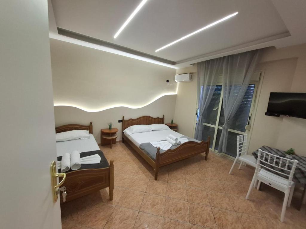 Postel nebo postele na pokoji v ubytování L&G Hotel