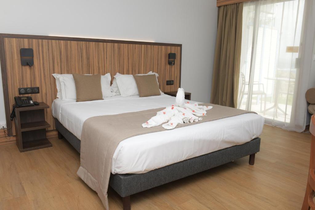 Postel nebo postele na pokoji v ubytování Carayou Hotel & SPA