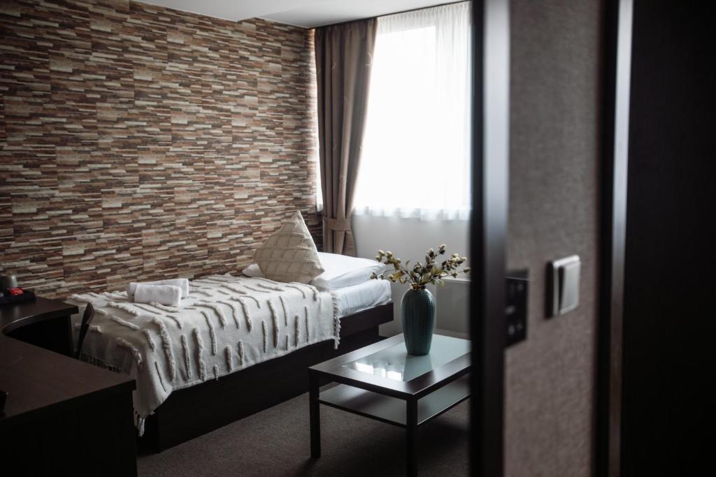 Postel nebo postele na pokoji v ubytování Interhotel Tatra