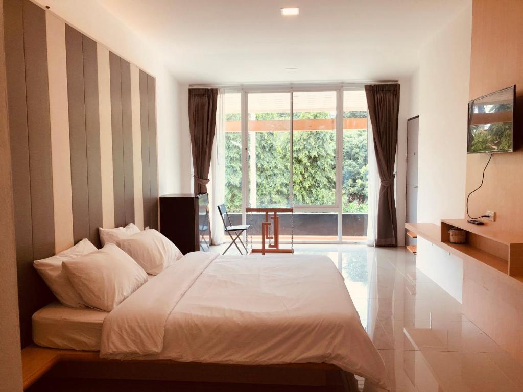 En eller flere senge i et værelse på Pai Casita walking street