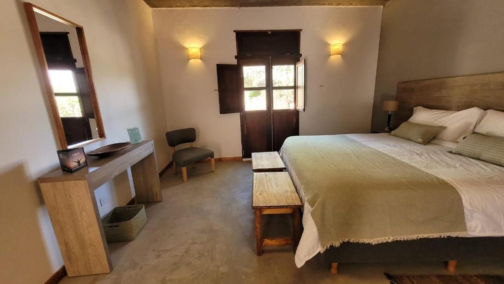 Postel nebo postele na pokoji v ubytování Adobe Hotel Fiambalá