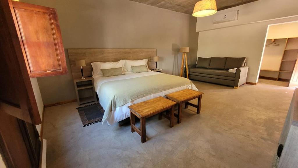 Postel nebo postele na pokoji v ubytování Adobe Hotel Fiambalá