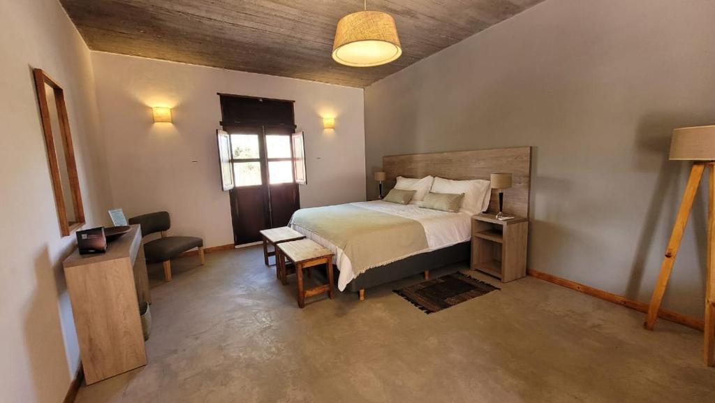 Postel nebo postele na pokoji v ubytování Adobe Hotel Fiambalá