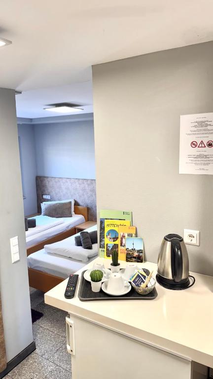 Postel nebo postele na pokoji v ubytování M-Hotel