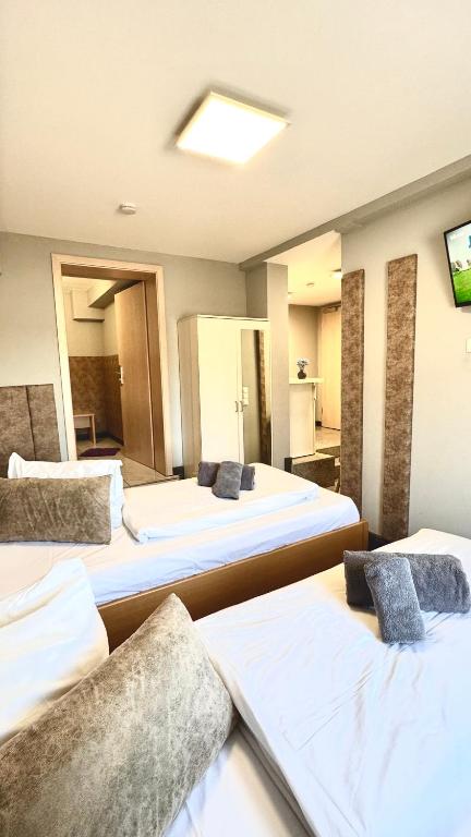Postel nebo postele na pokoji v ubytování M-Hotel
