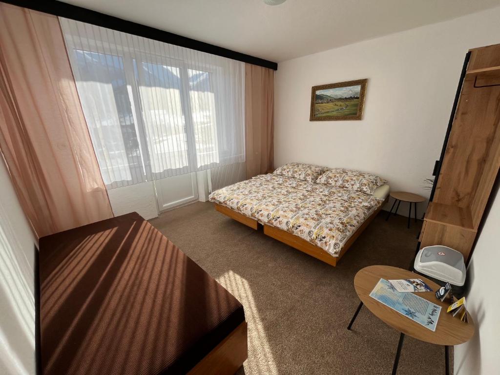 Postel nebo postele na pokoji v ubytování U Milušky
