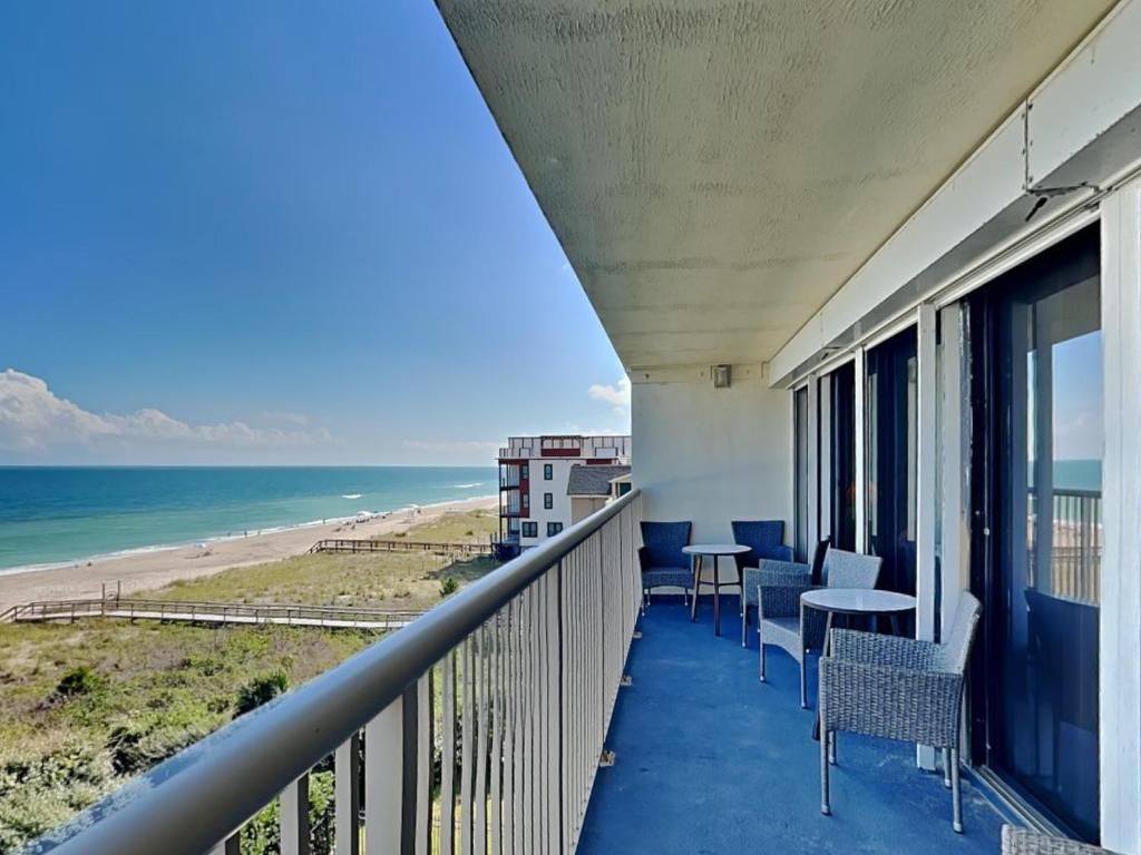 a balcony with a view of the beach at Pelican Watch #405 in Carolina Beach